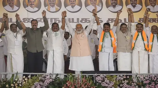 NDA leaders, led by Prime Minister Narendra Modi, raise hands in unity at a Tamil Nadu rally